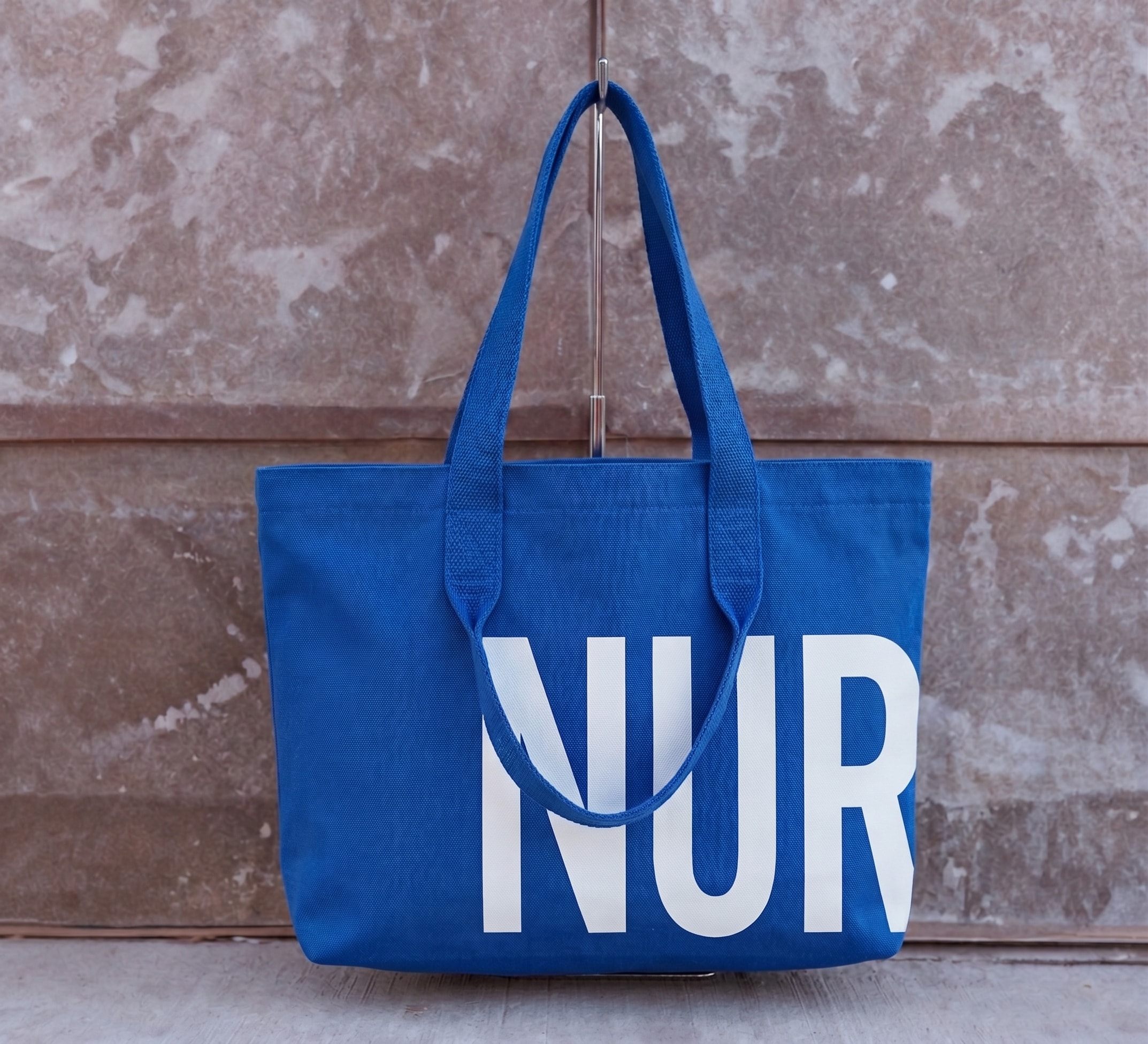 The Integrity Tote Royal Blue / White NUR Limited Edition — front view